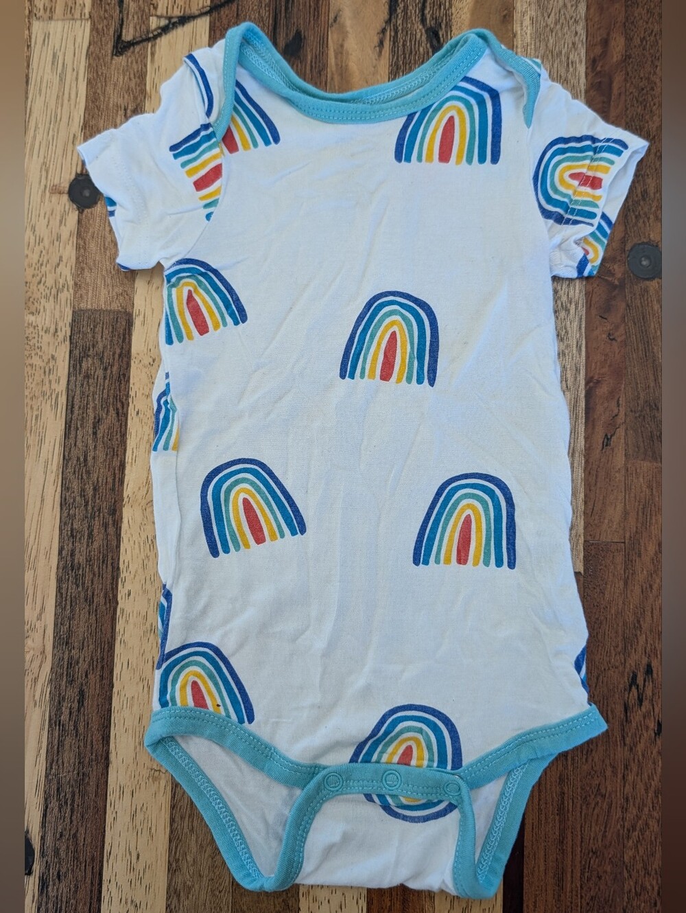 Kyte BABY White Bodysuit with Blue-Trimmed Rainbow Print